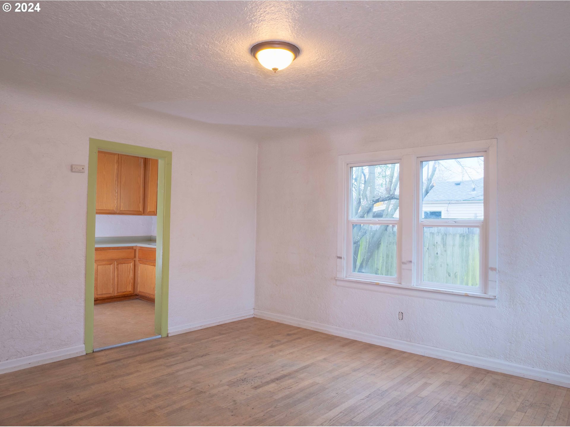 2947 Elmira Road Eugene, OR 97402 - Photo 4 of 29 a view of an empty room with a window