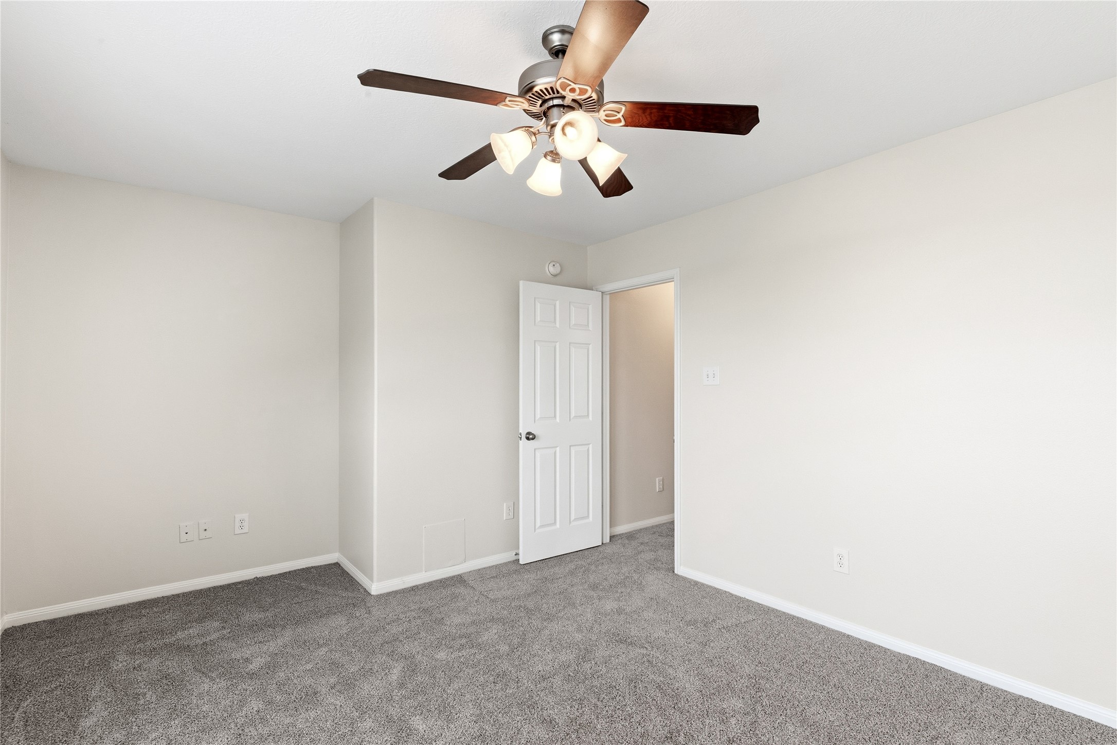 6211 Stone Hill Road Spring, TX 77389 - Photo 33 of 43 an empty room with a chandelier fan and windows