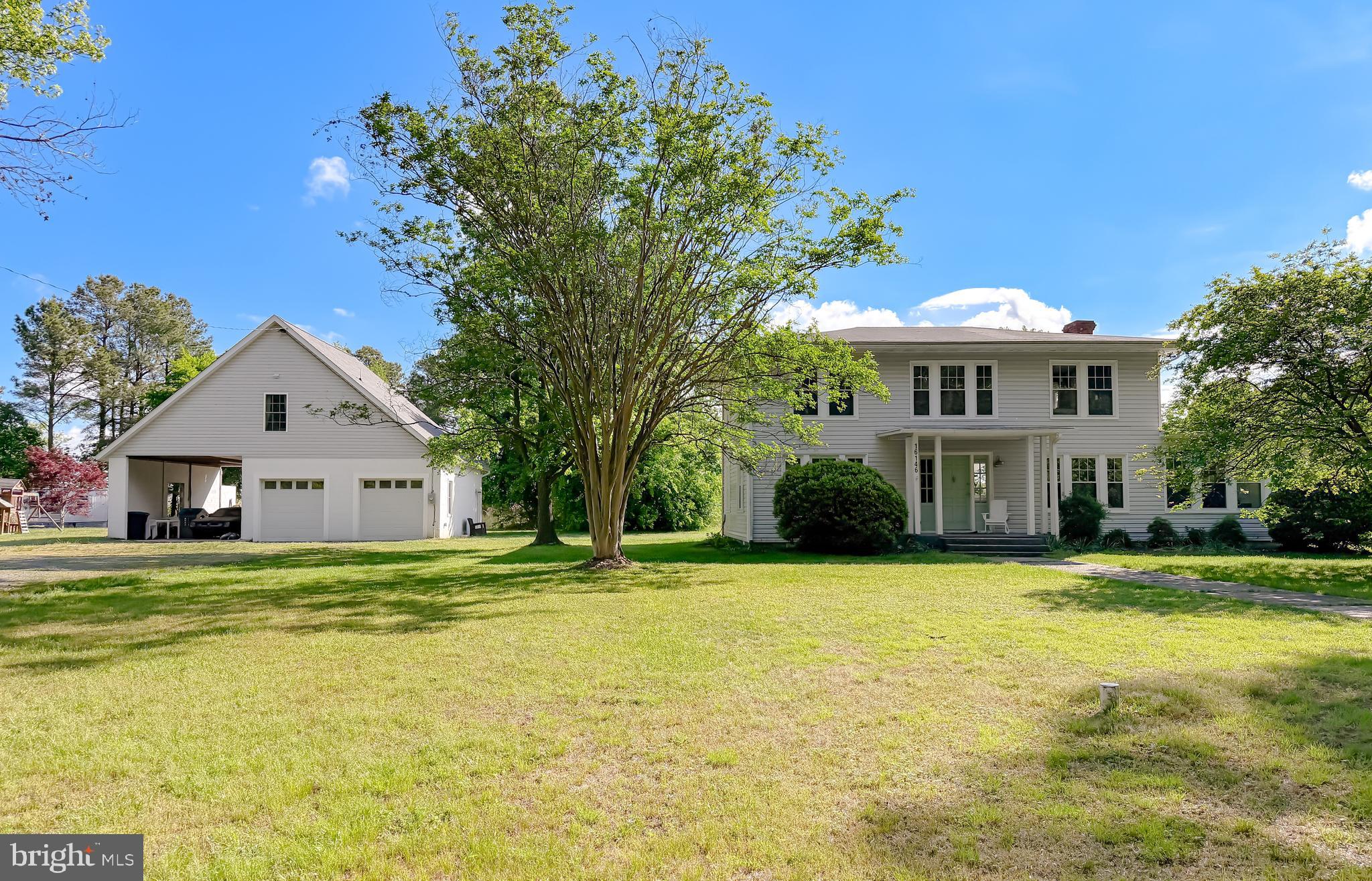 16146 Thomas Road Piney Point, MD 20674 - Photo 2 of 57 a front view of a house with a yard