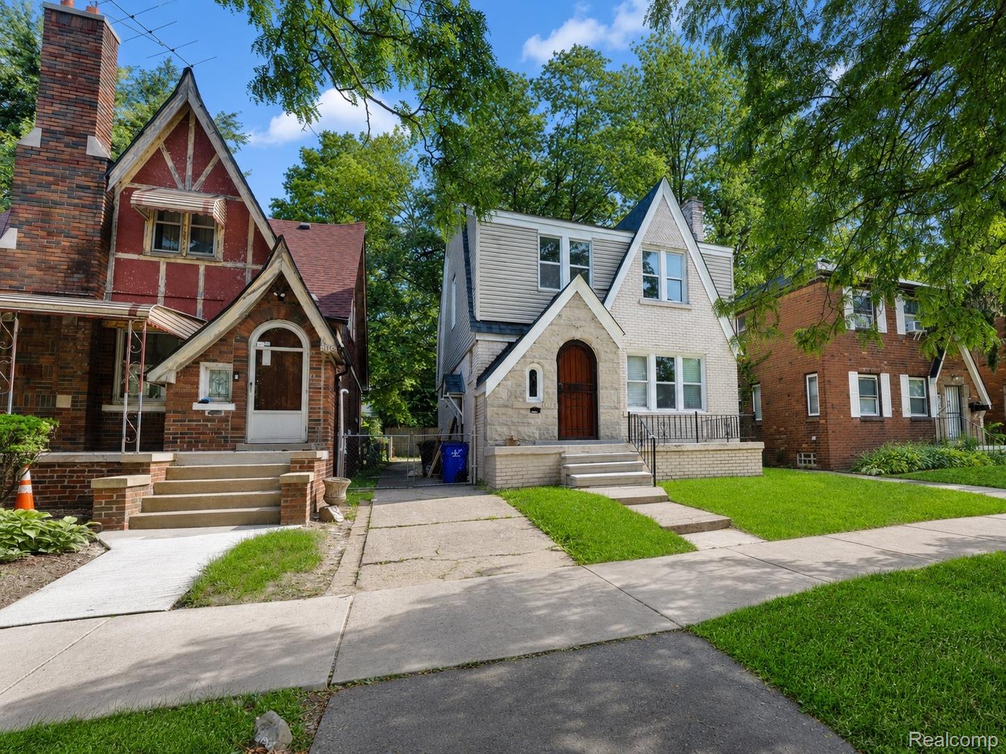 9175 Devonshire Road Detroit, MI 48224 - Photo 22 of 23 Gabled home featuring a light-colored stucco facade with stone accents
