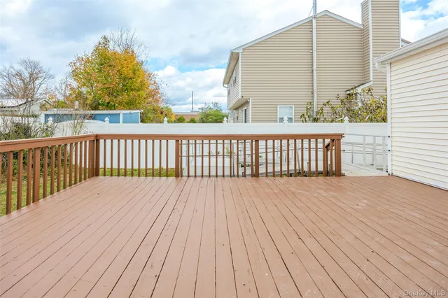 a view of balcony with deck and wooden floor