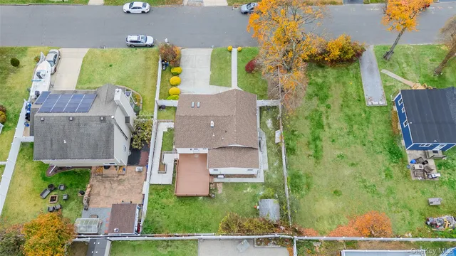 an aerial view of a house with a swimming pool