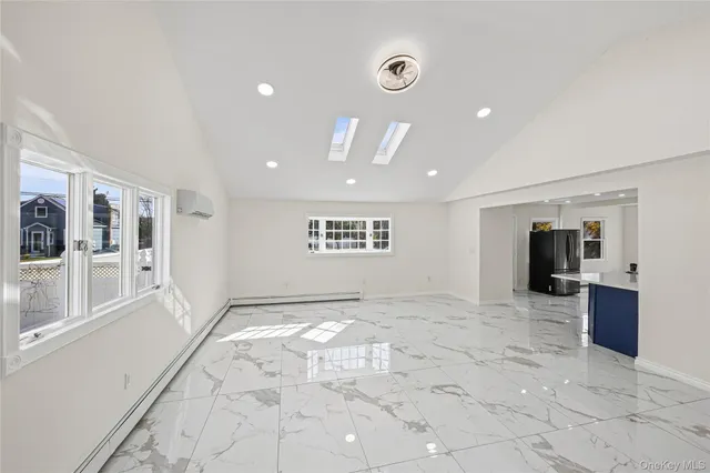a view of a hallway with a kitchen