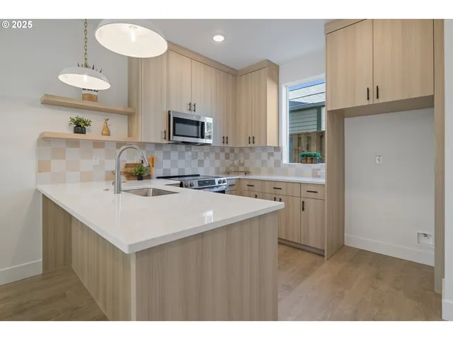 a front view of a house with garden and plants