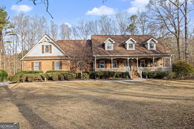 a front view of a building with a yard