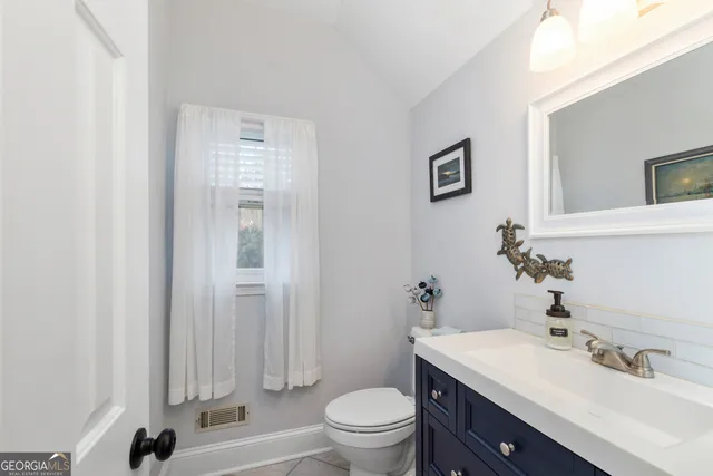 a bedroom with furniture and window