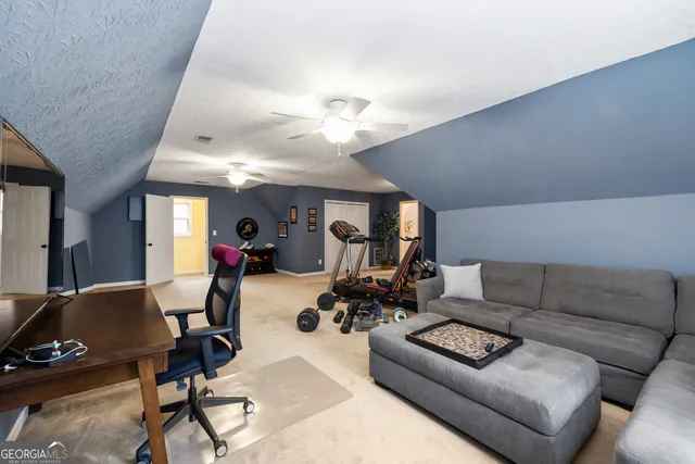 a bedroom with a bed and furniture