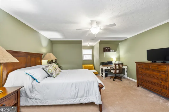 a living room with furniture a pool table and a fireplace