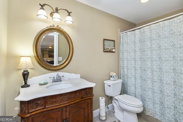 a kitchen with a table and chairs in it