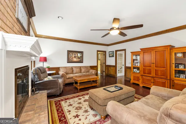 a spacious bedroom with a bed and a chandelier