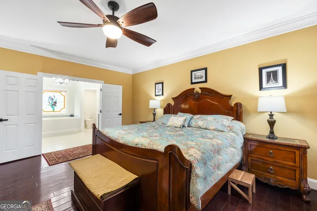 a spacious bathroom with a sink a vanity a mirror and a shower