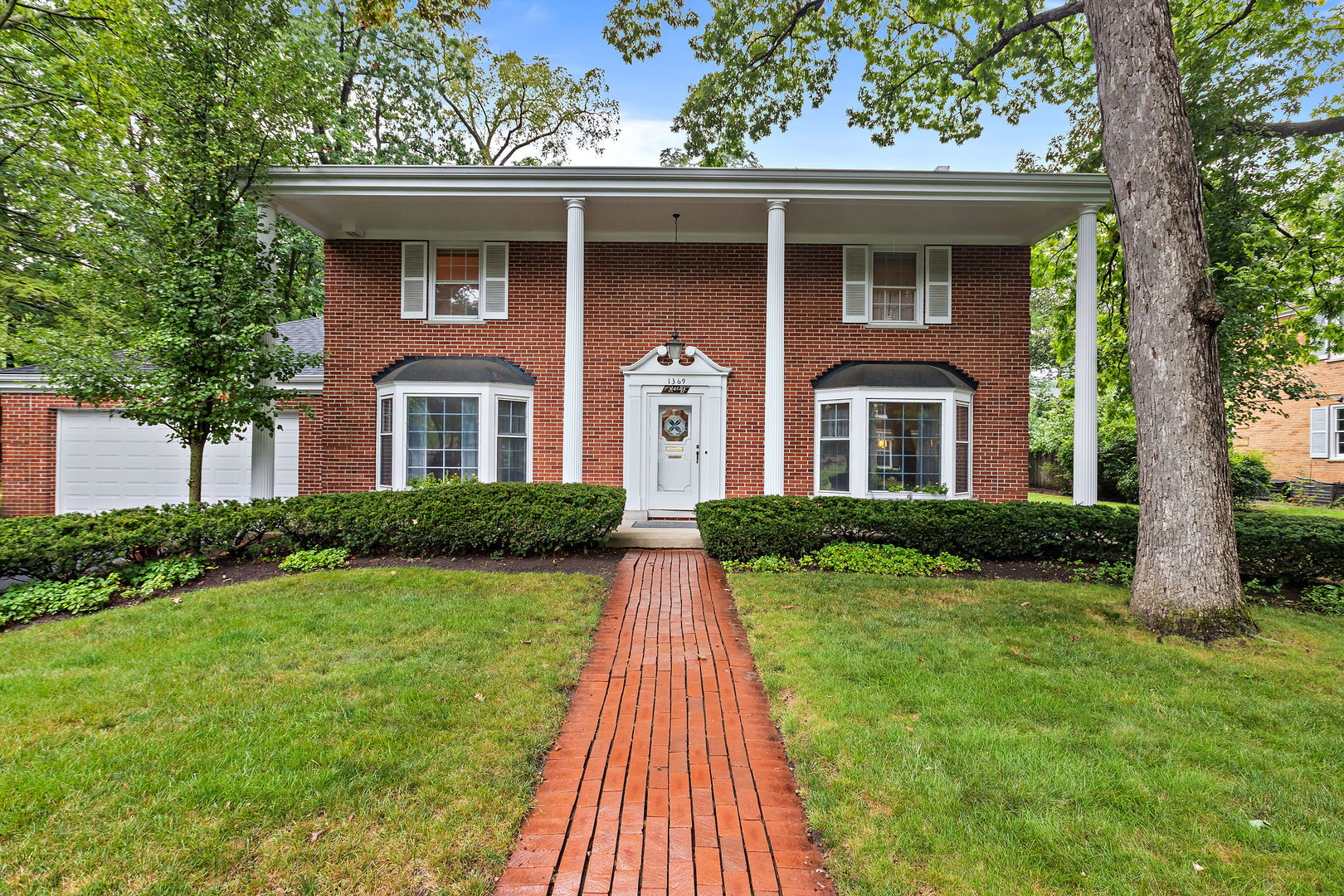 a front view of a house with yard