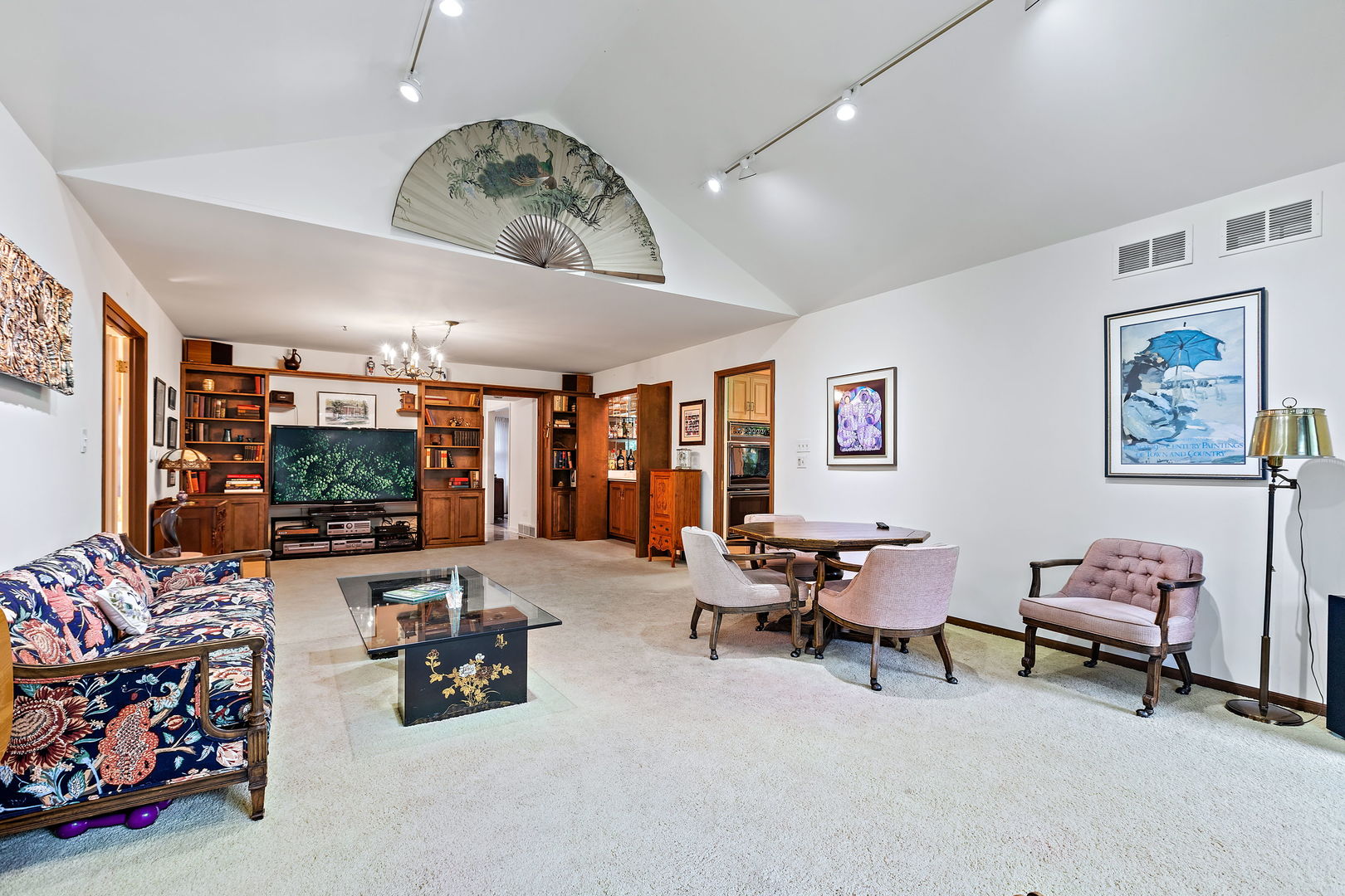 1369 Tower Road Winnetka, IL 60093 - Photo 14 of 31 a living room with furniture and a flat screen tv
