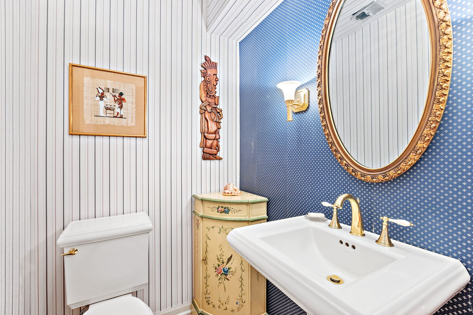 1369 Tower Road Winnetka, IL 60093 - Photo 23 of 31 a bathroom with a toilet a sink and a mirror