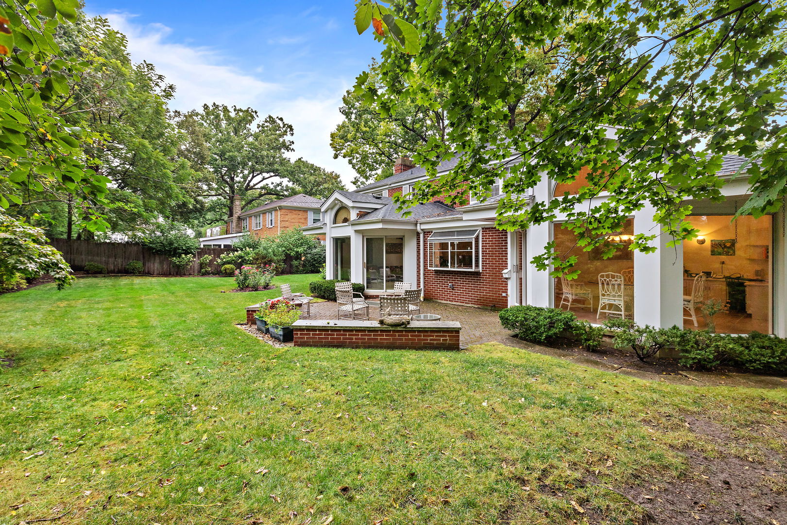 1369 Tower Road Winnetka, IL 60093 - Photo 26 of 31 a view of a house with backyard and sitting area