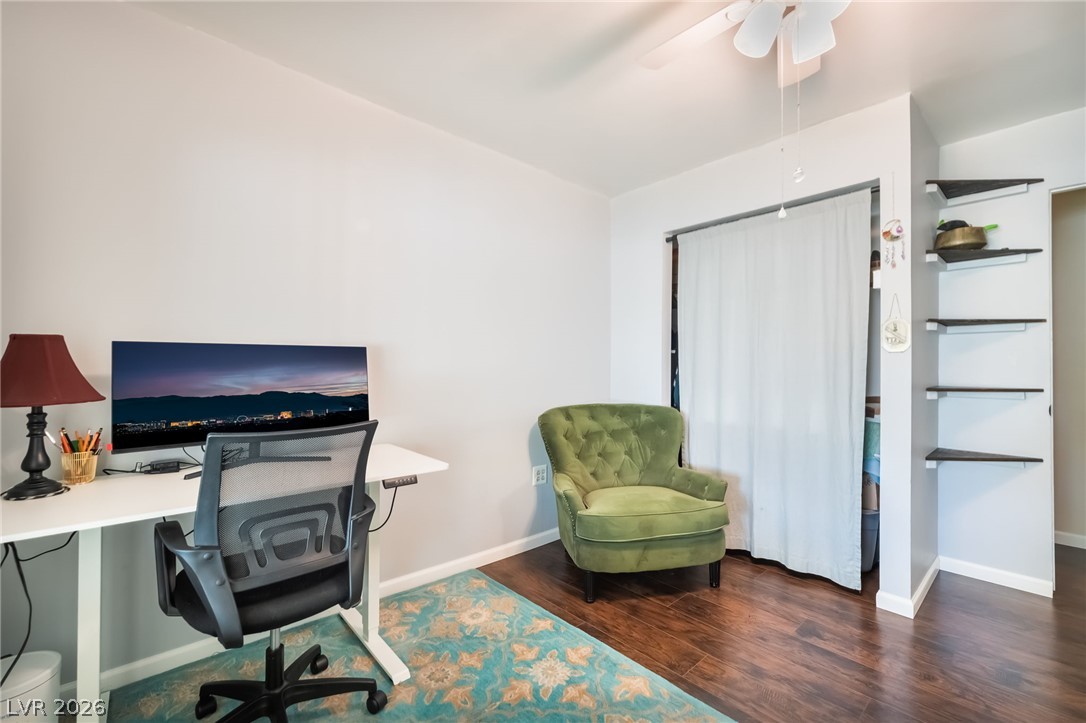1324 Appaloosa Road Boulder City, NV 89005 - Photo 25 of 38 Rich wood-look flooring and built-in shelving anchor this versatile home workspace.
Bedroom #4