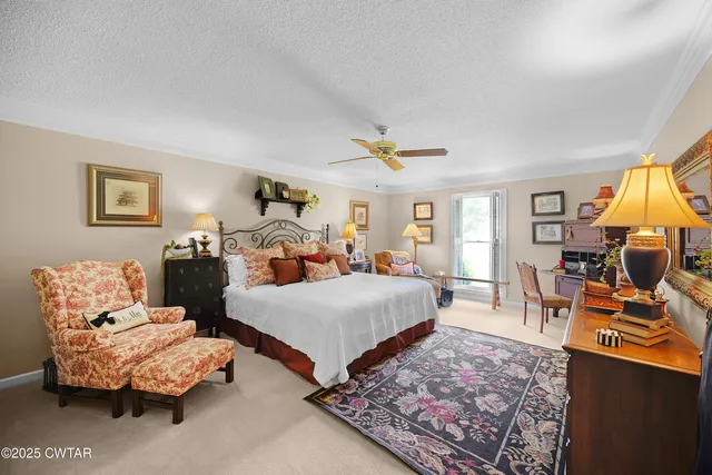 a bedroom with bed and glass windows