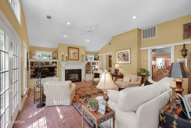 a very nice looking living room with a large window