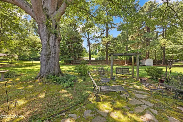 a view of outdoor space with deck and yard