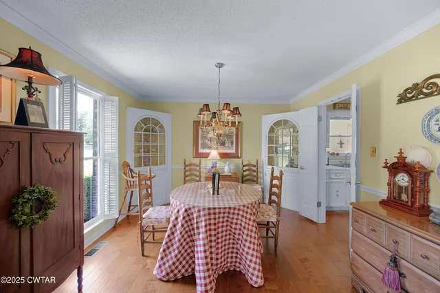 a bedroom with furniture and a chandelier