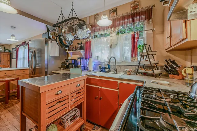 a kitchen that has a lot of cabinets in it