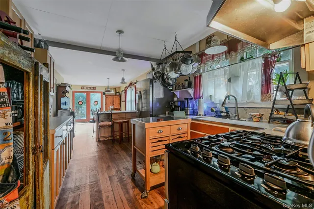 a kitchen with stainless steel appliances granite countertop a stove and a sink
