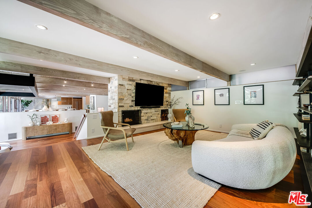 681 Brooktree Road Santa Monica, CA 90402 - Photo 24 of 33 a living room with furniture and a flat screen tv