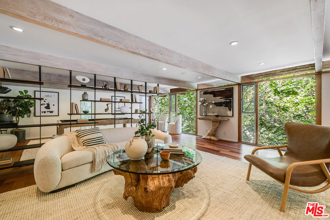 681 Brooktree Road Santa Monica, CA 90402 - Photo 25 of 33 a living room with furniture and a large window