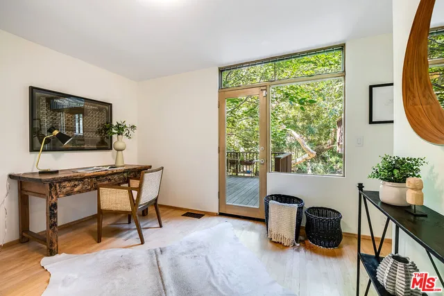 a view of a roof deck with wooden floor and outdoor seating