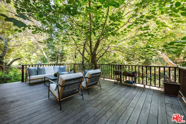 a bedroom with a large bed and a large window