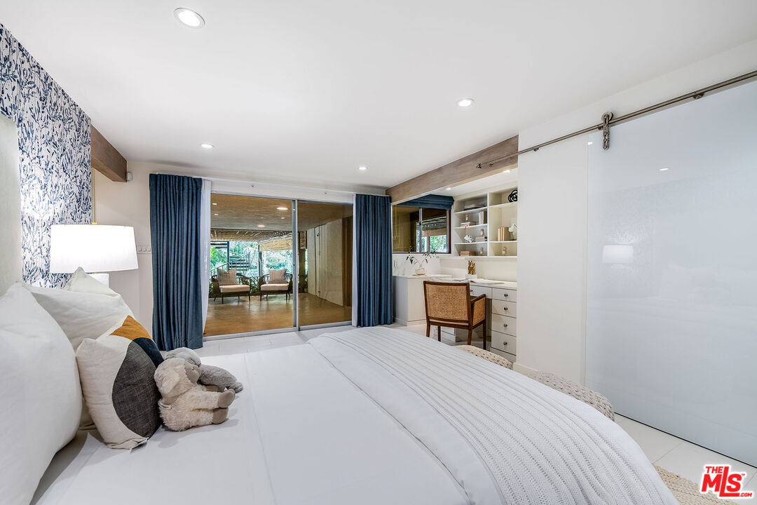 681 Brooktree Road Santa Monica, CA 90402 - Photo 32 of 33 a bedroom with a large bed and a large window