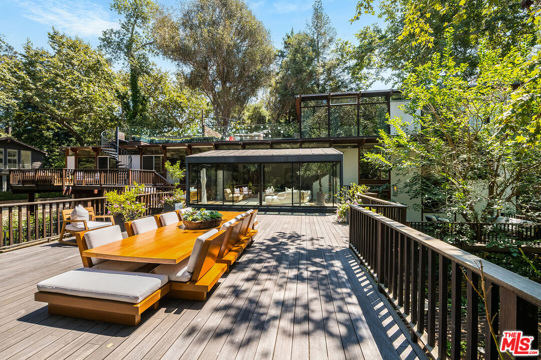 681 Brooktree Road Santa Monica, CA 90402 - Photo 9 of 33 a view of a swimming pool with a patio