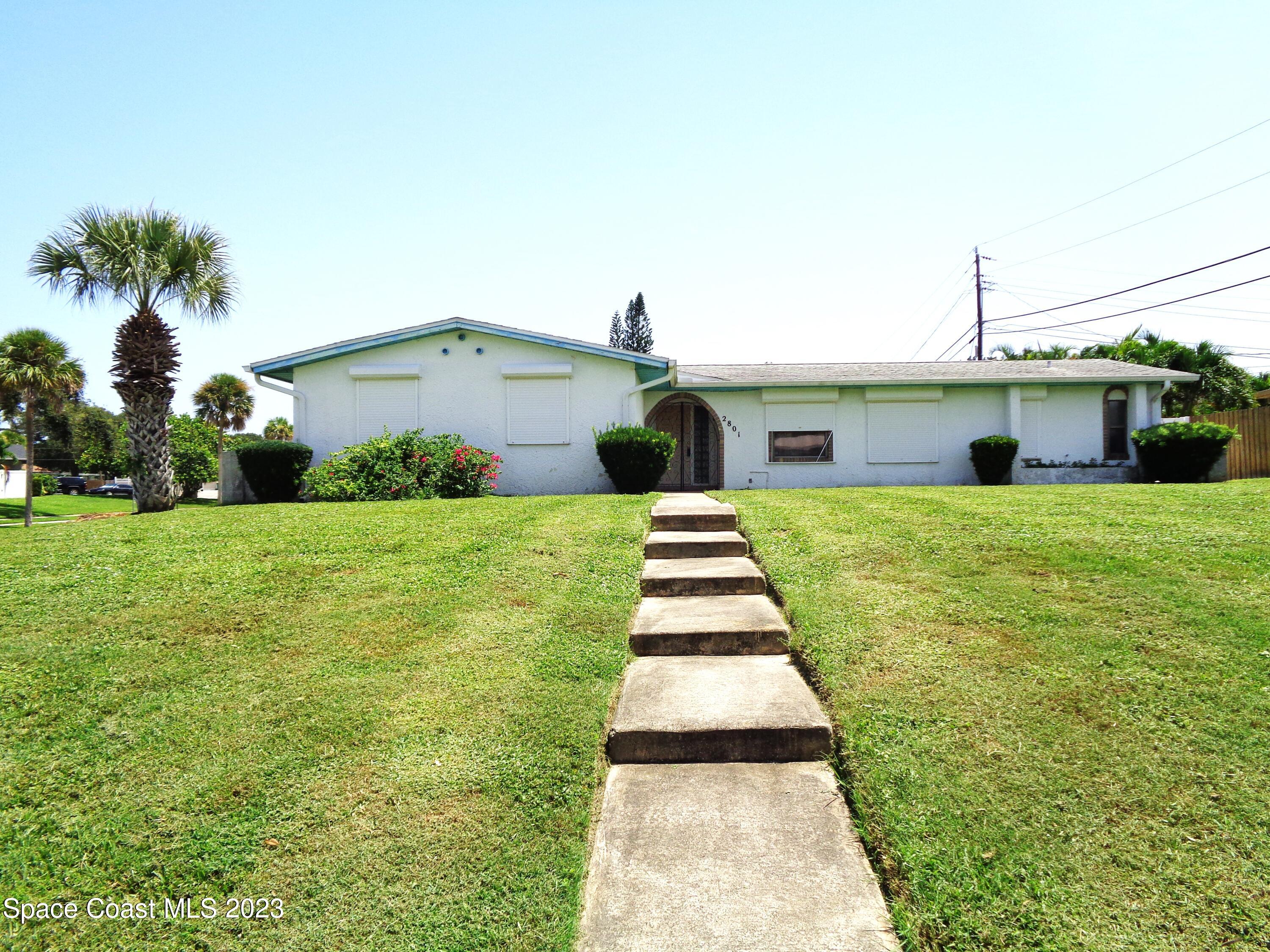 a house view with garden space