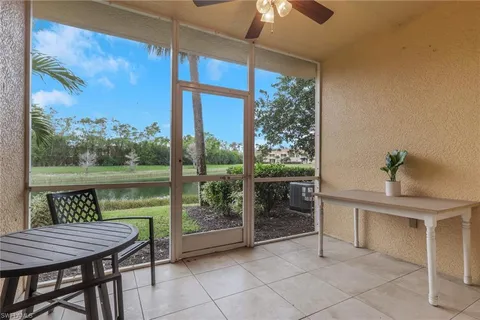 a view of a patio with a table chairs and backyard