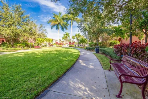 a view of a backyard with sitting area