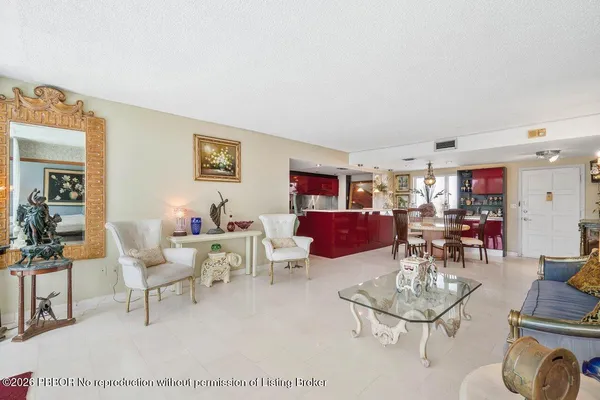 a kitchen with stainless steel appliances granite countertop a sink and a refrigerator