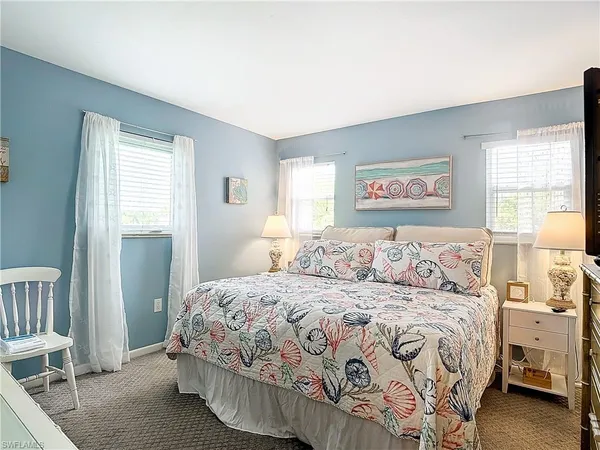 a bathroom with a toilet a sink and a mirror