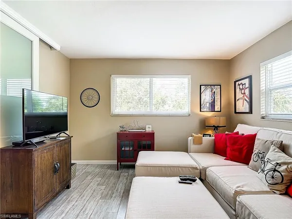 a living room with furniture and a flat screen tv
