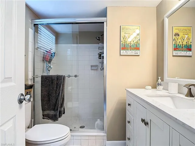 a bathroom with a sink double vanity and shower