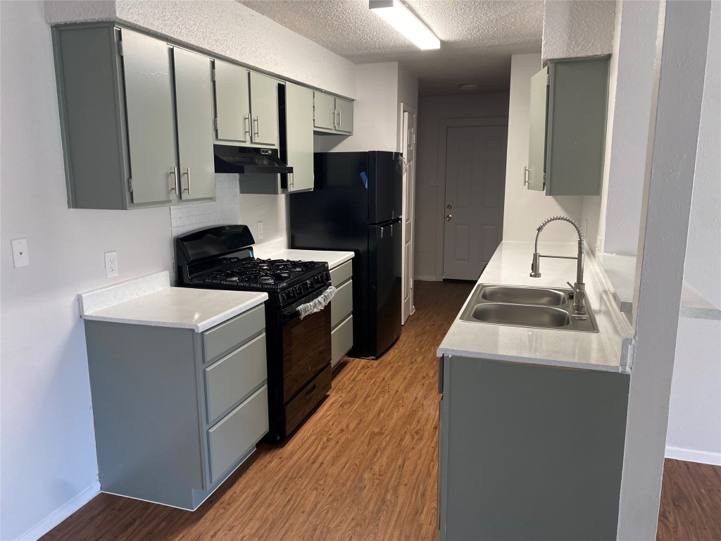 2300 Misty Morning Way, Unit A Round Rock, TX 78664 - Photo 5 of 16 a kitchen with a sink stove and refrigerator
