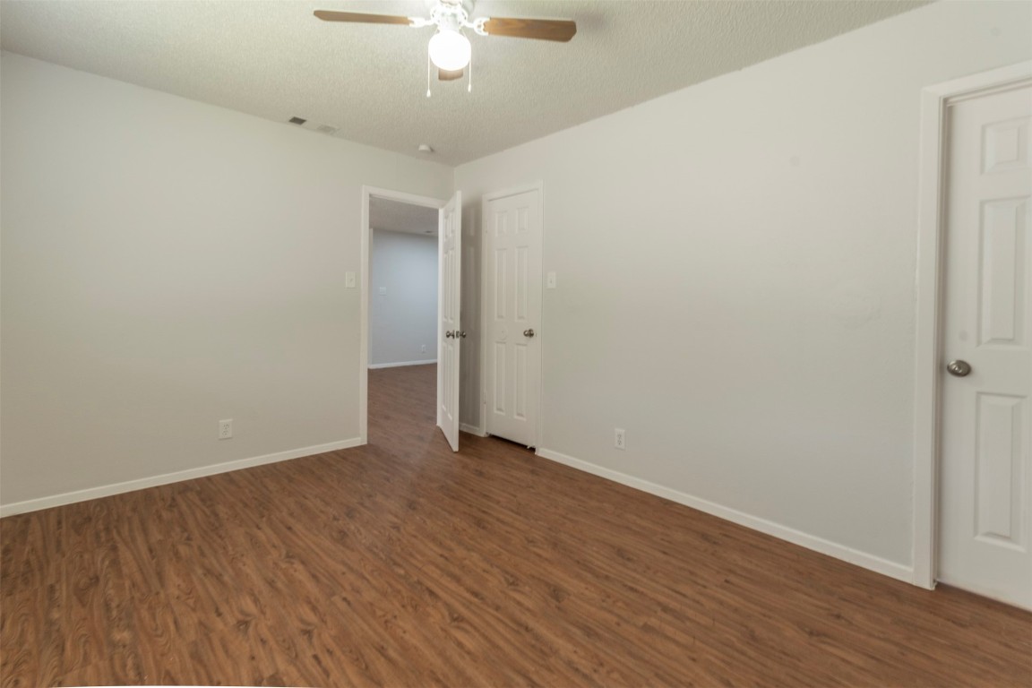 2300 Misty Morning Way, Unit A Round Rock, TX 78664 - Photo 10 of 16 a view of an empty room with wooden floor