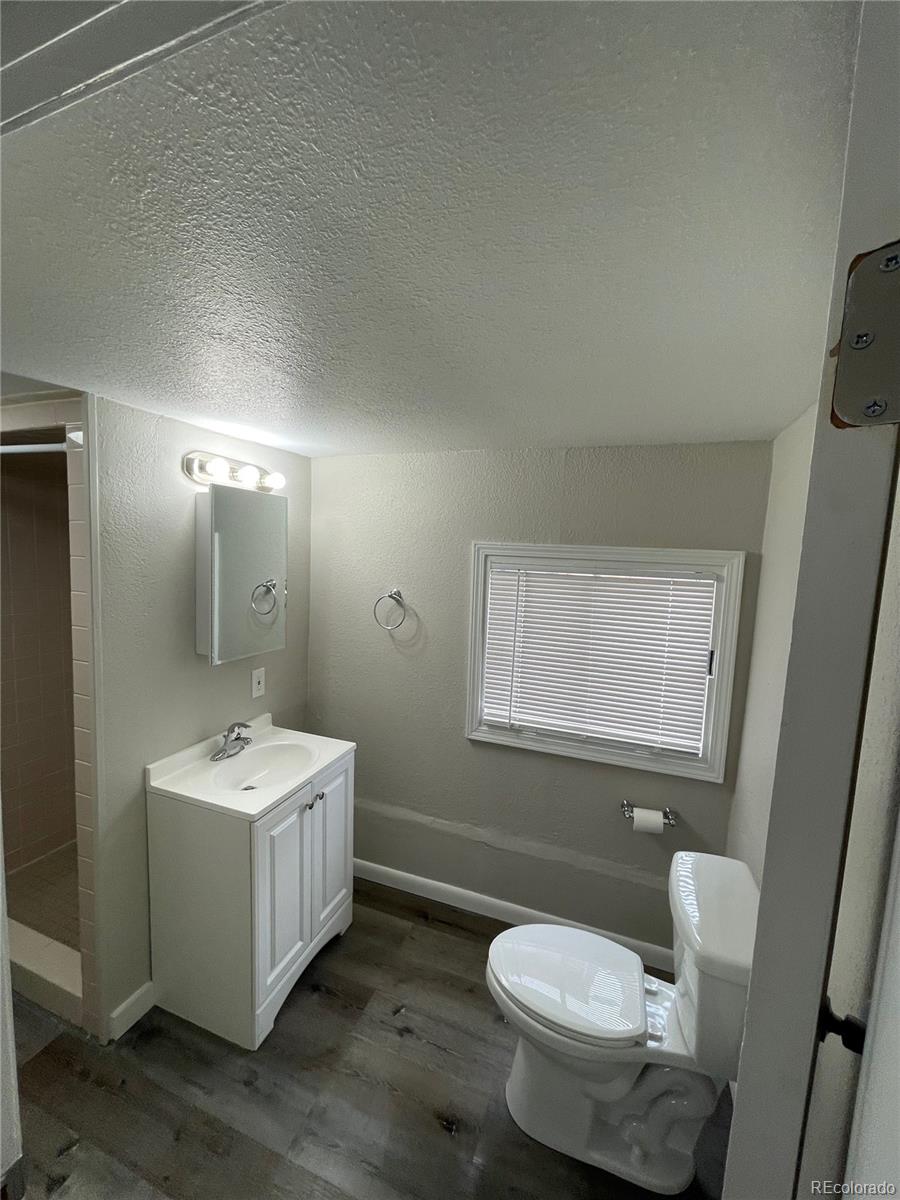 275 Junction Loop Road Empire, CO 80438 - Photo 4 of 18 a bathroom with a toilet sink and mirror