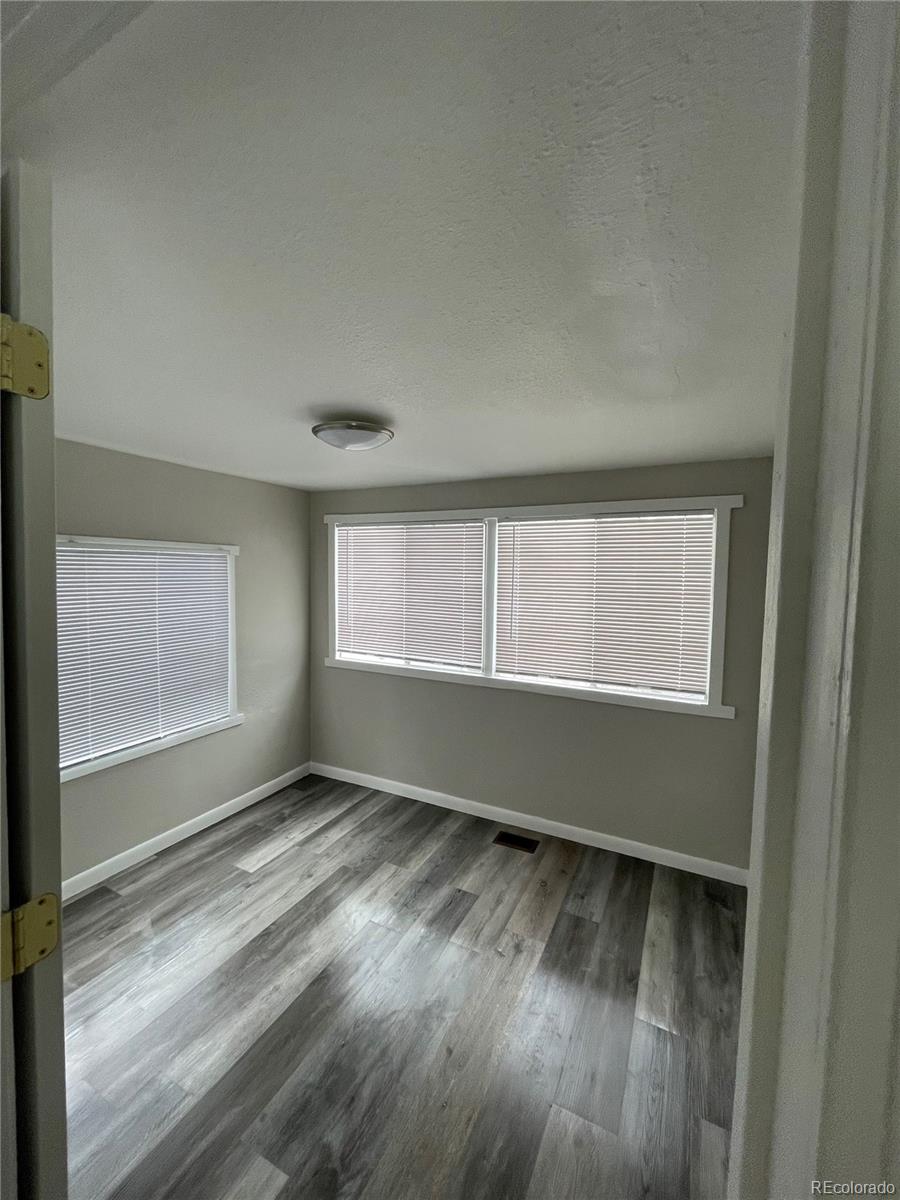 275 Junction Loop Road Empire, CO 80438 - Photo 7 of 18 a view of room with window and hardwood floor