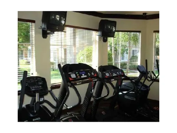 a balcony view with a dining table and chairs