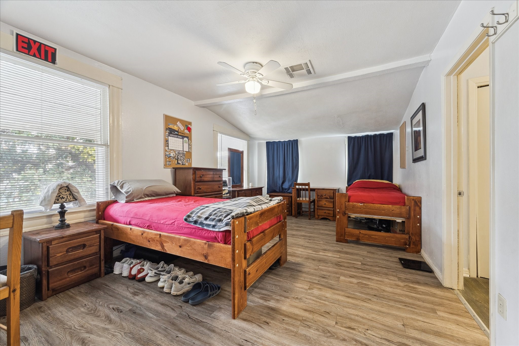 240 West 23rd Street Houston, TX 77008 - Photo 16 of 31 a bedroom with a bed and wooden floor