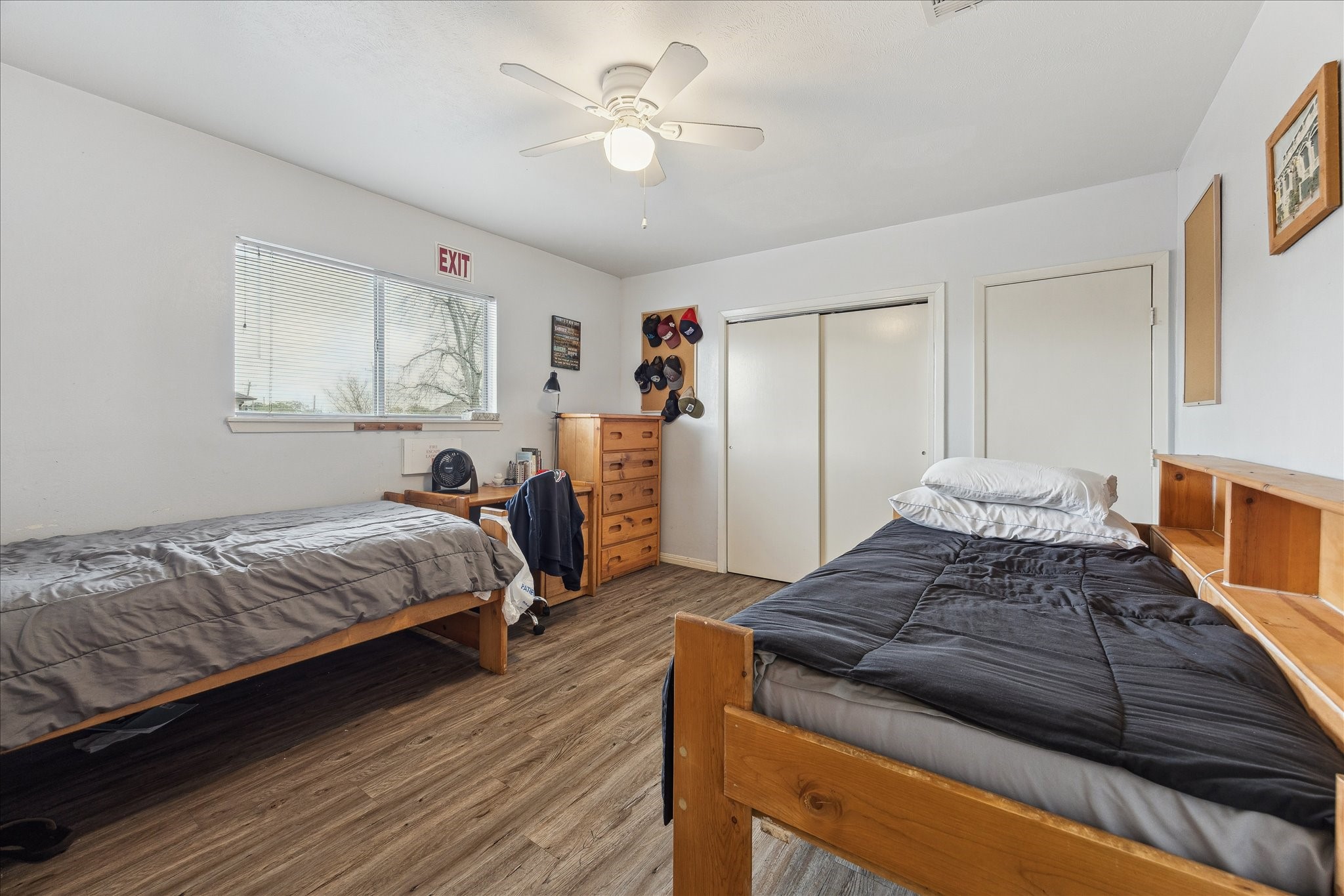 240 West 23rd Street Houston, TX 77008 - Photo 23 of 31 a bedroom with a bed and wooden floor