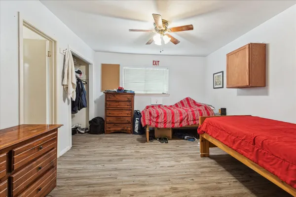 a bedroom with furniture and a window