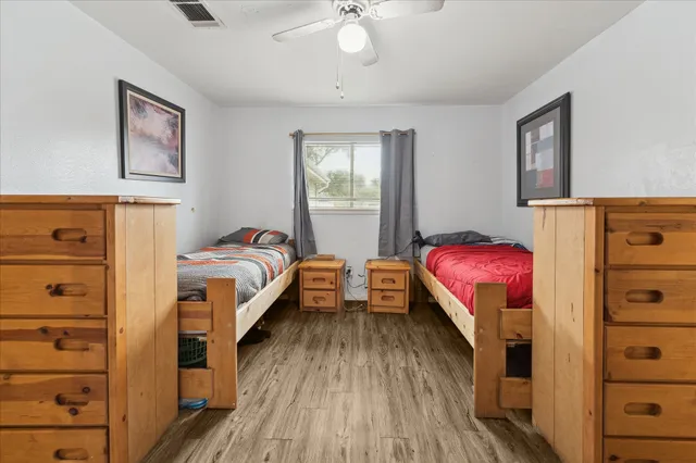 a bathroom with a double vanity sink toilet mirror and bathtub