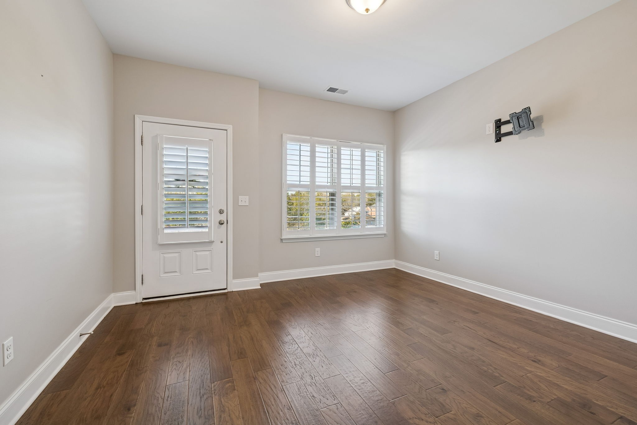 352 Buckner Cir Mount Mount Juliet, TN 37122 - Photo 9 of 51 an empty room with wooden floor and windows