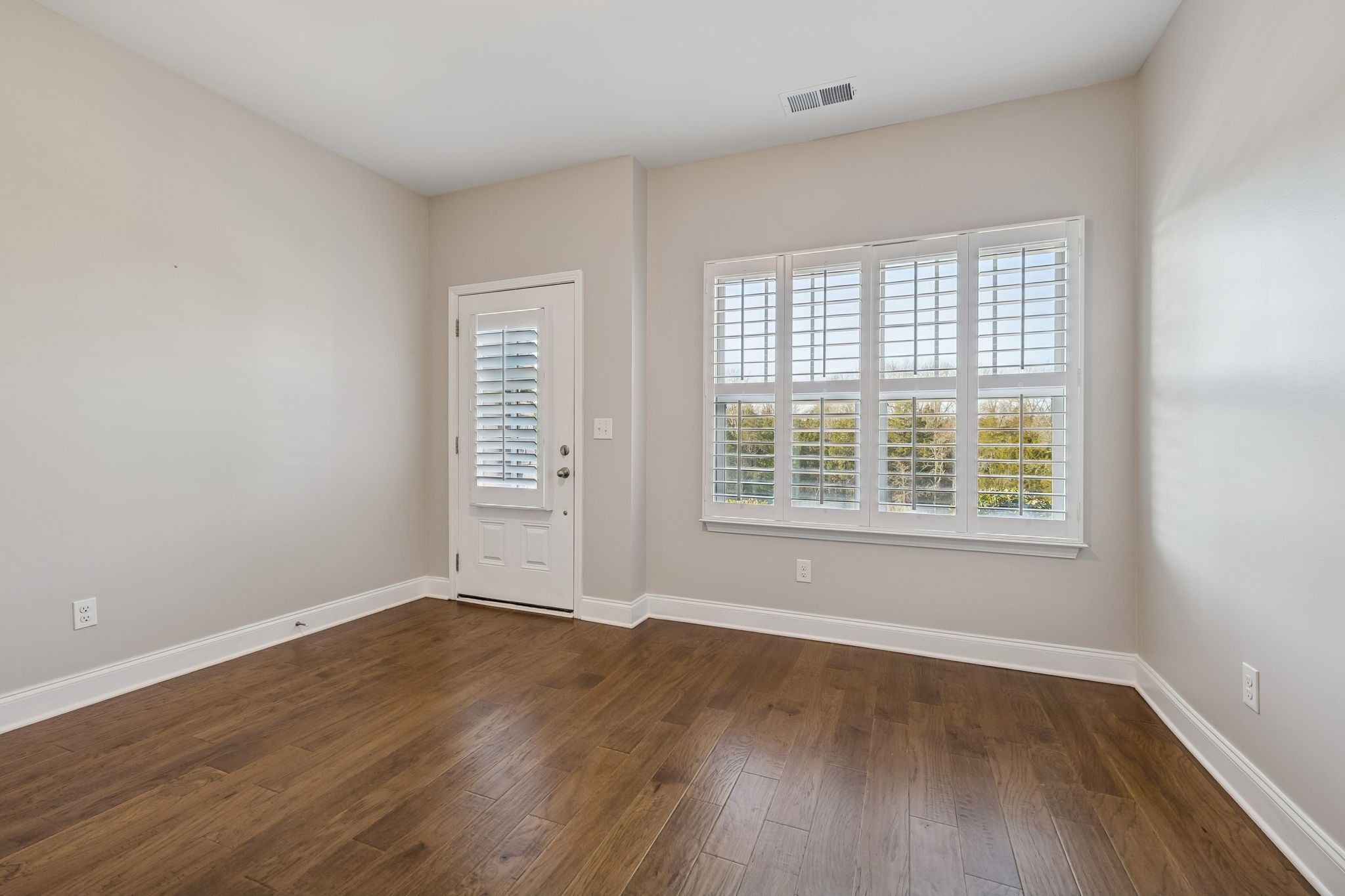 352 Buckner Cir Mount Mount Juliet, TN 37122 - Photo 10 of 51 an empty room with wooden floor and windows
